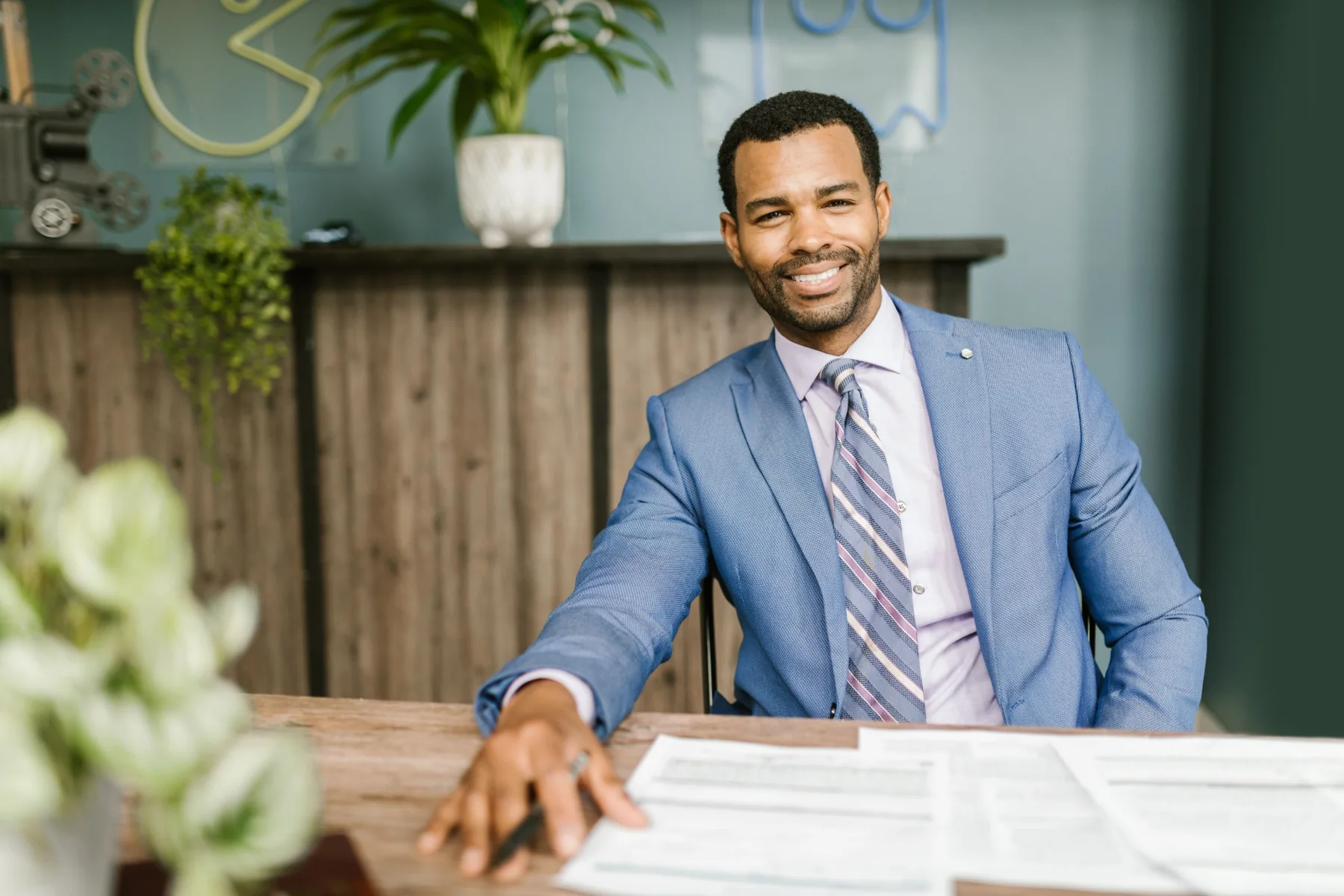 Business professional seated at a desk in a modern office